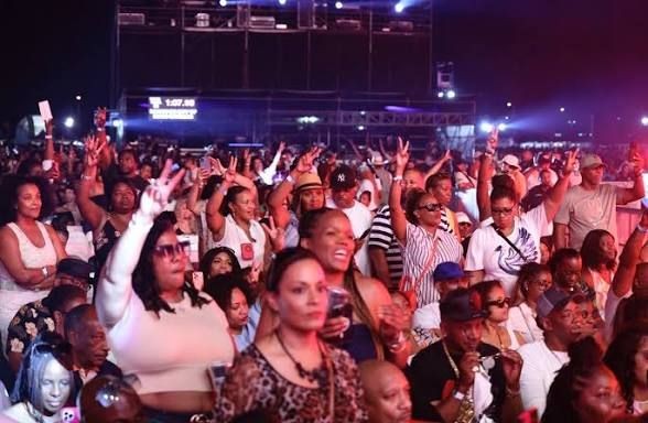 Symbolic depiction of a global tribe connected by music, energy, and shared vision, representing fan movement creation.